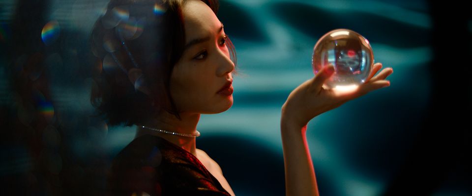 ARRI Impression Filters "The Impressionists" HongKong woman holding a glass sphere and looking at it