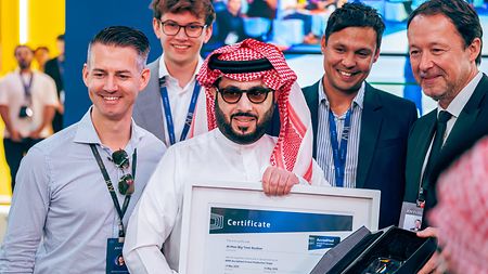 His Excellency Turki Alalshikh (center) accepting the ARRI Stage Accreditation on behalf of the Al Hisn Big Time Studios and GEA together with several members of the ARRI Team at the Joy Forum