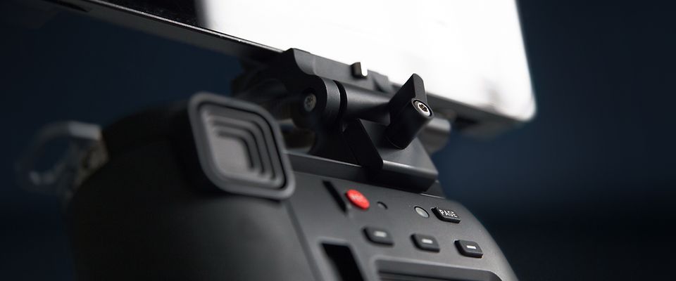 Handheld camera control unit ARRI Hi-5 whose purpose designed monitor bracket is set in the focus. 