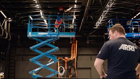 ARRI staff working on the installation of the lighting rig-system for the German WELT broadcasting news studio.