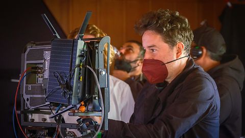 Director looks at the arri camera 2022 footage on set.
