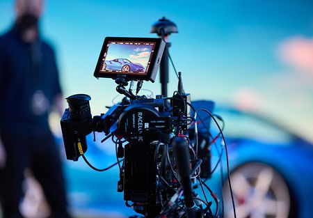 Behind the scenes image of a car-filming scene in a flexible & solution-oriented production studio.