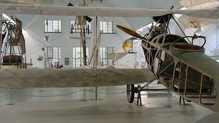 Picture of a Rumpler C IV airplane taken from the back on the left side.