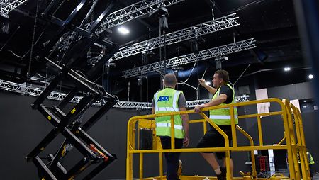 ARRI staff working on commissioning and installation of the lighting rigs for a fixed LED stage. @ Ian Wallman