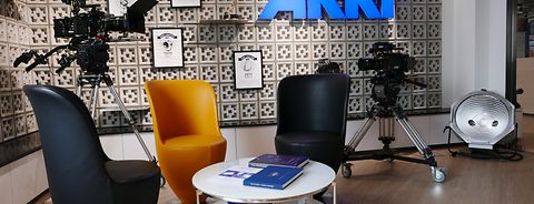 ARRI in Hong Kong - Inviting lobby with seating and prominently displayed awards and ARRI logo in the back surrounded by camera & lighting equipment