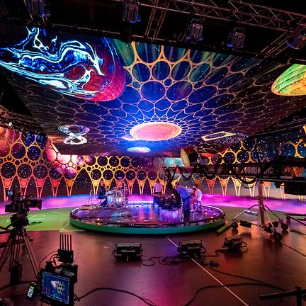 BTS shot of Coldplay's special event, filmed on a virtual production studio to create a supportive and captivating ambiance.